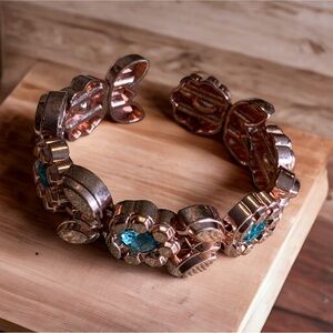 Vintage rose gold/copper tone bracelet with blue stone accents